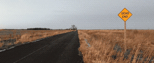 Image of a highway with dead, light brown grass to either side of it. A grey sky. The only thing that stands out is a yellow, diamond-shaped sign that says 'DEAD END.'